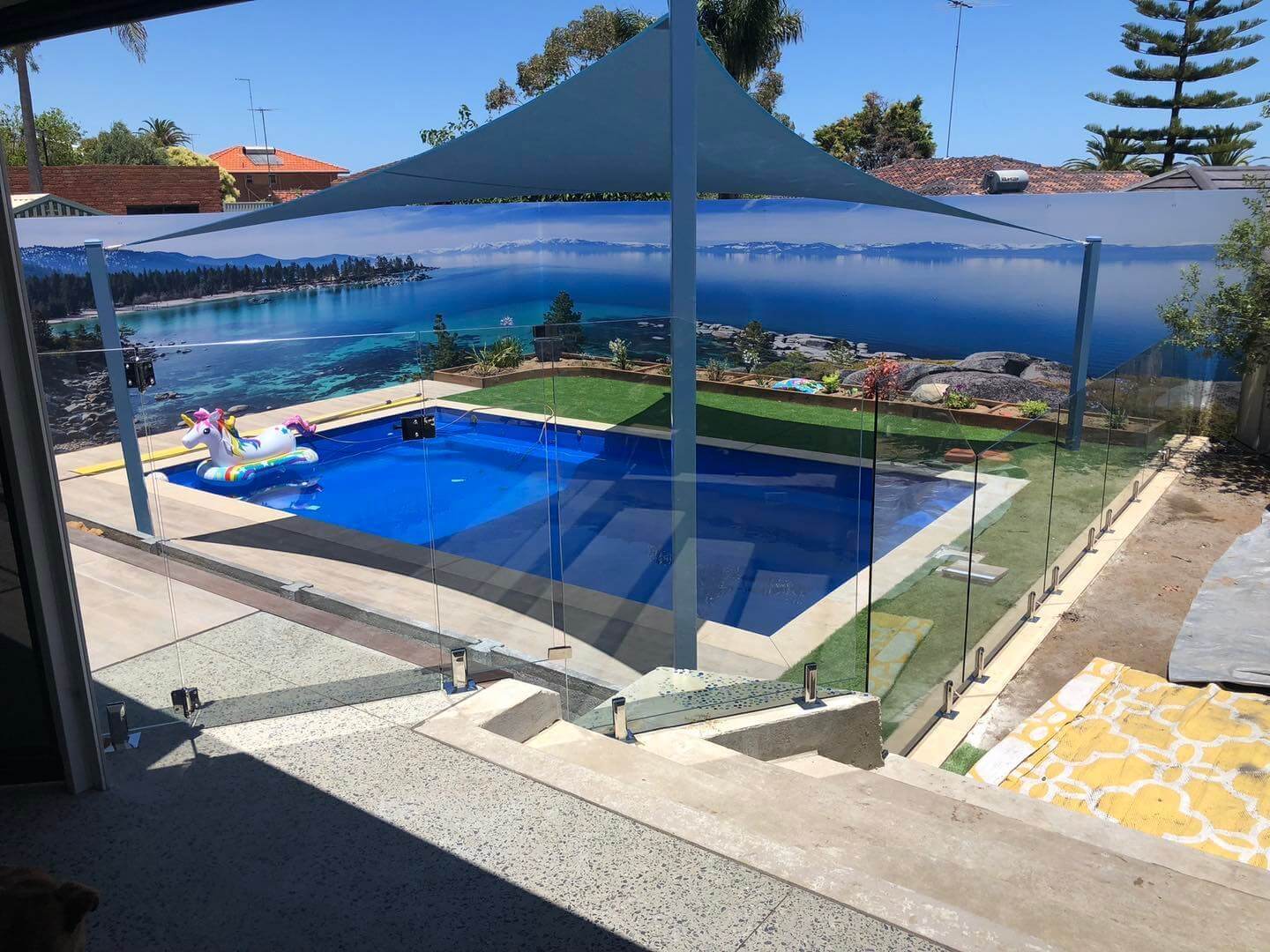 Modern pool with glass pool fencing